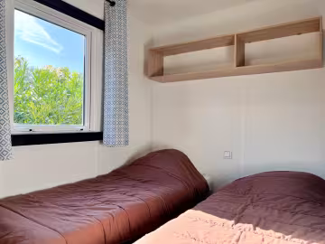 Chambre à deux lits d’un chalet Premium 2